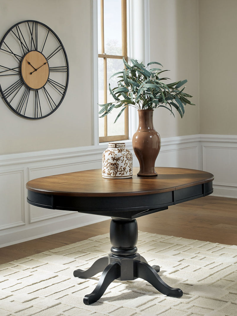 Clorazi - Oval Dining Room Butterfly Extension Table - Black / Brown